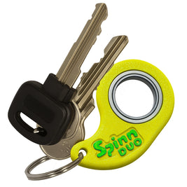 SpinnDuo Citrus Shift fingertip spinner attached to a set of keys, showing its portable everyday carry design
