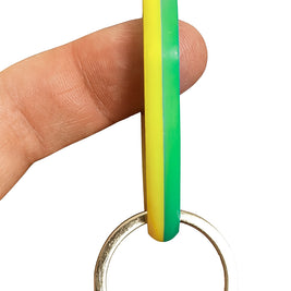 SpinnDuo Citrus Shift spinner balanced on a fingertip, showing smooth rotation and relaxed control
