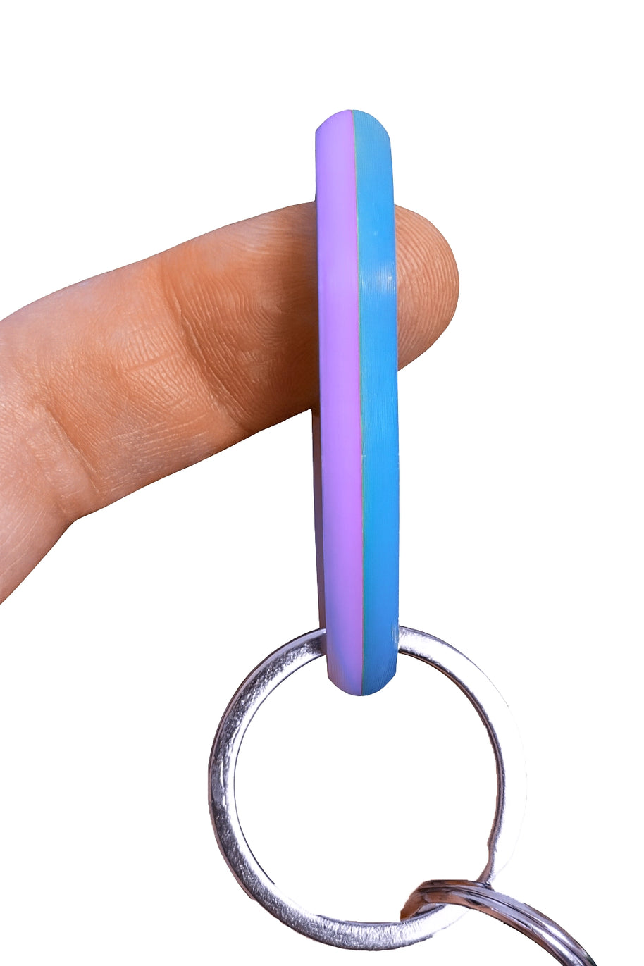 SpinnDuo Cosmic Tide spinner balanced on a fingertip, showing smooth motion and a calm, controlled spin
