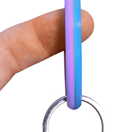 SpinnDuo Cosmic Tide spinner balanced on a fingertip, showing smooth motion and a calm, controlled spin
