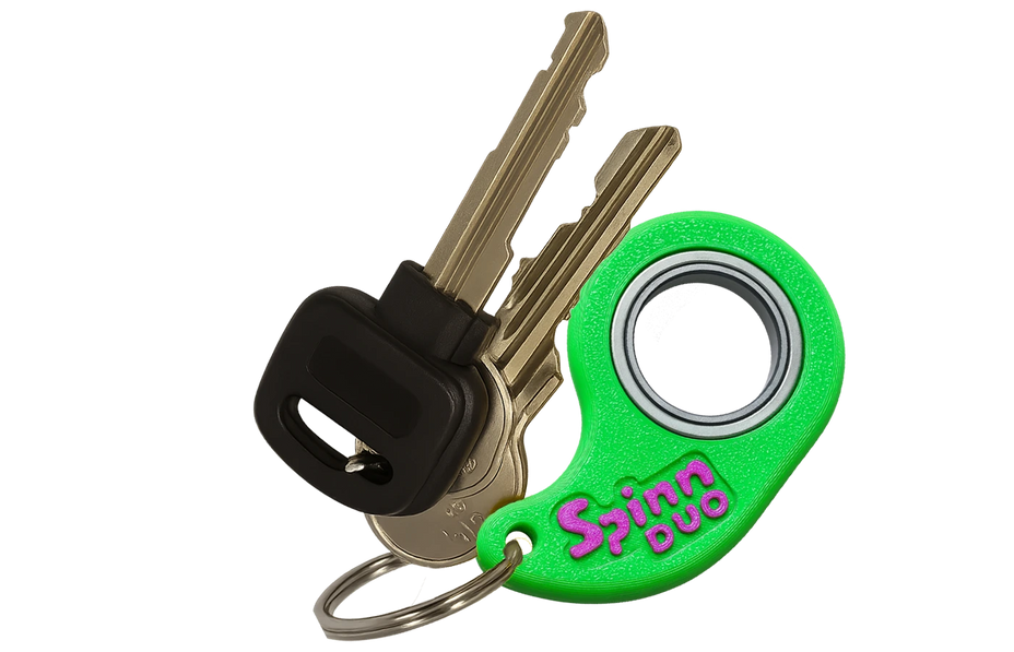 SpinnDuo dual-color fingertip spinner attached to a keychain for everyday carry

