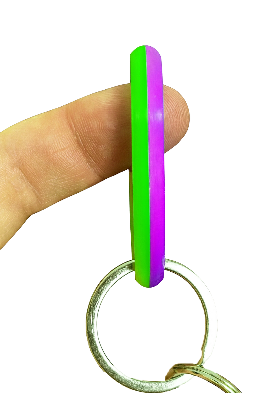 SpinnDuo Neon Bloom spinner balanced on a fingertip, emphasizing focused motion and precise hand control
