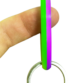 SpinnDuo Neon Bloom spinner balanced on a fingertip, emphasizing focused motion and precise hand control
